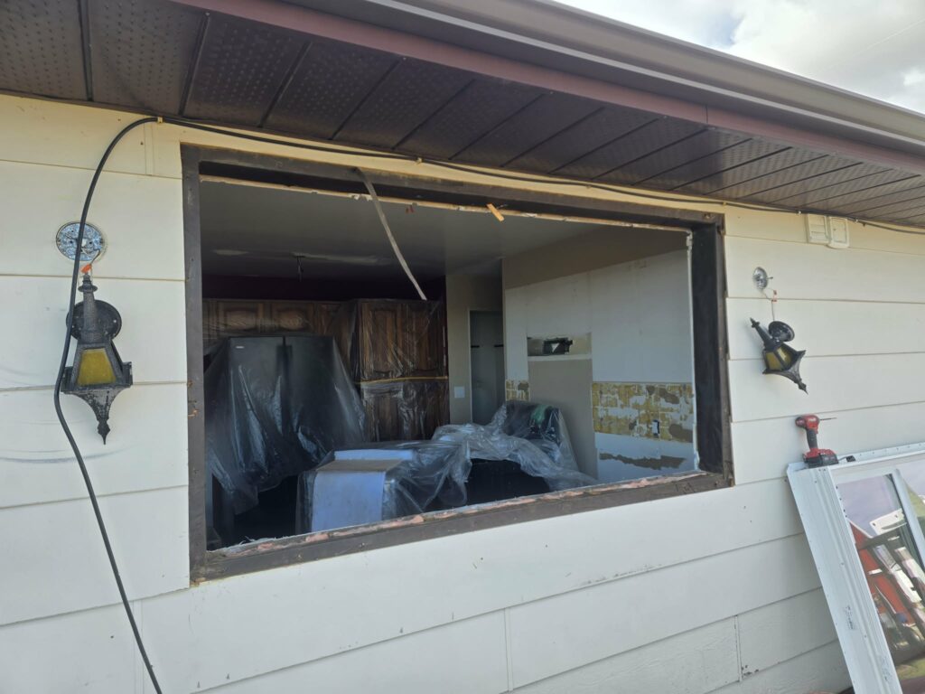 Existing window removed and the wall opening exposed during replacement