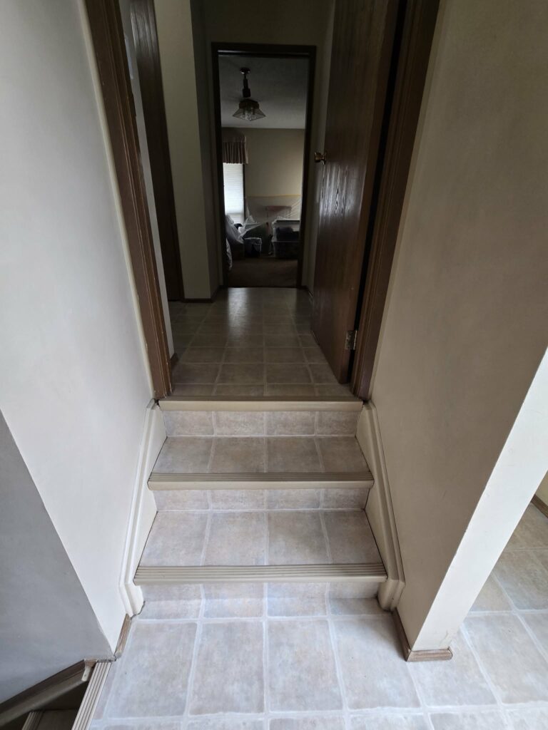 Short hallway and two-step flooring transition during early project work