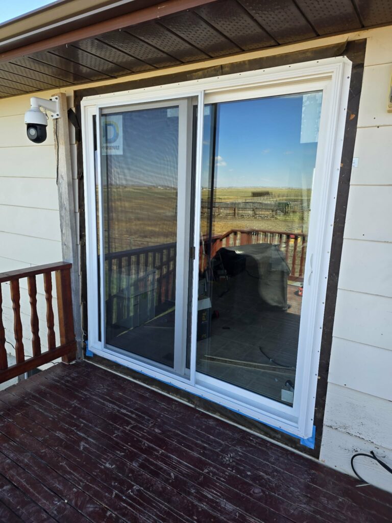 Replacement balcony door installed with perimeter finishing still underway
