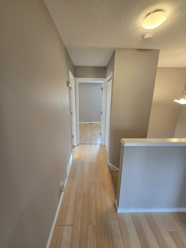 Reverse view of the finished upstairs hall and refreshed trim